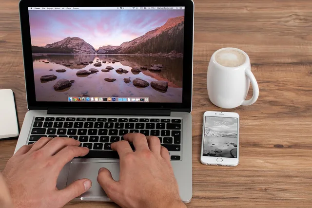 office, freelancer, computer, business, work, laptop, creative, iphone, macbook, apple inc, notebook, mobile, tablet, workplace, job, coffee, web, phone, technology, device, screen, typing, working, desk, cup, coffee cup, mug. Mobile devices for work